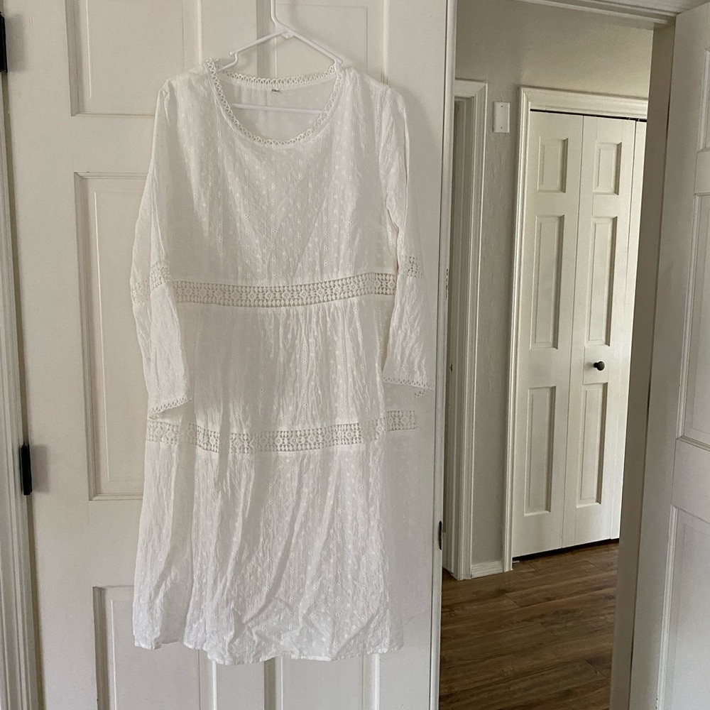 White eyelet dress. Knee length.